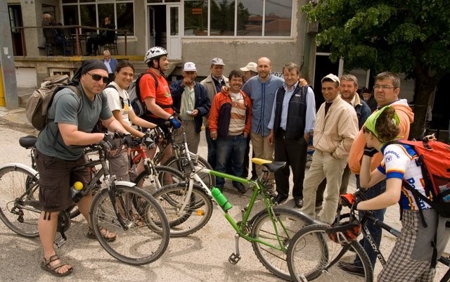 Cyclists visiting small village
